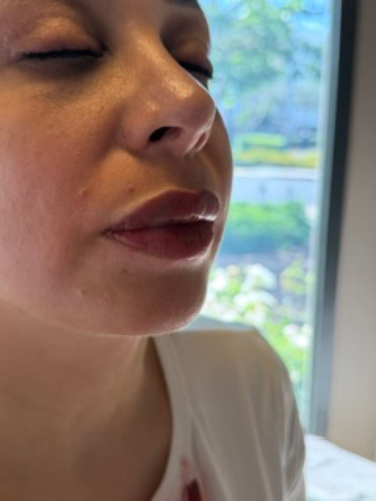 Fresh rose lip blush result at BonBrow — glossy, defined lips photographed right after the appointment